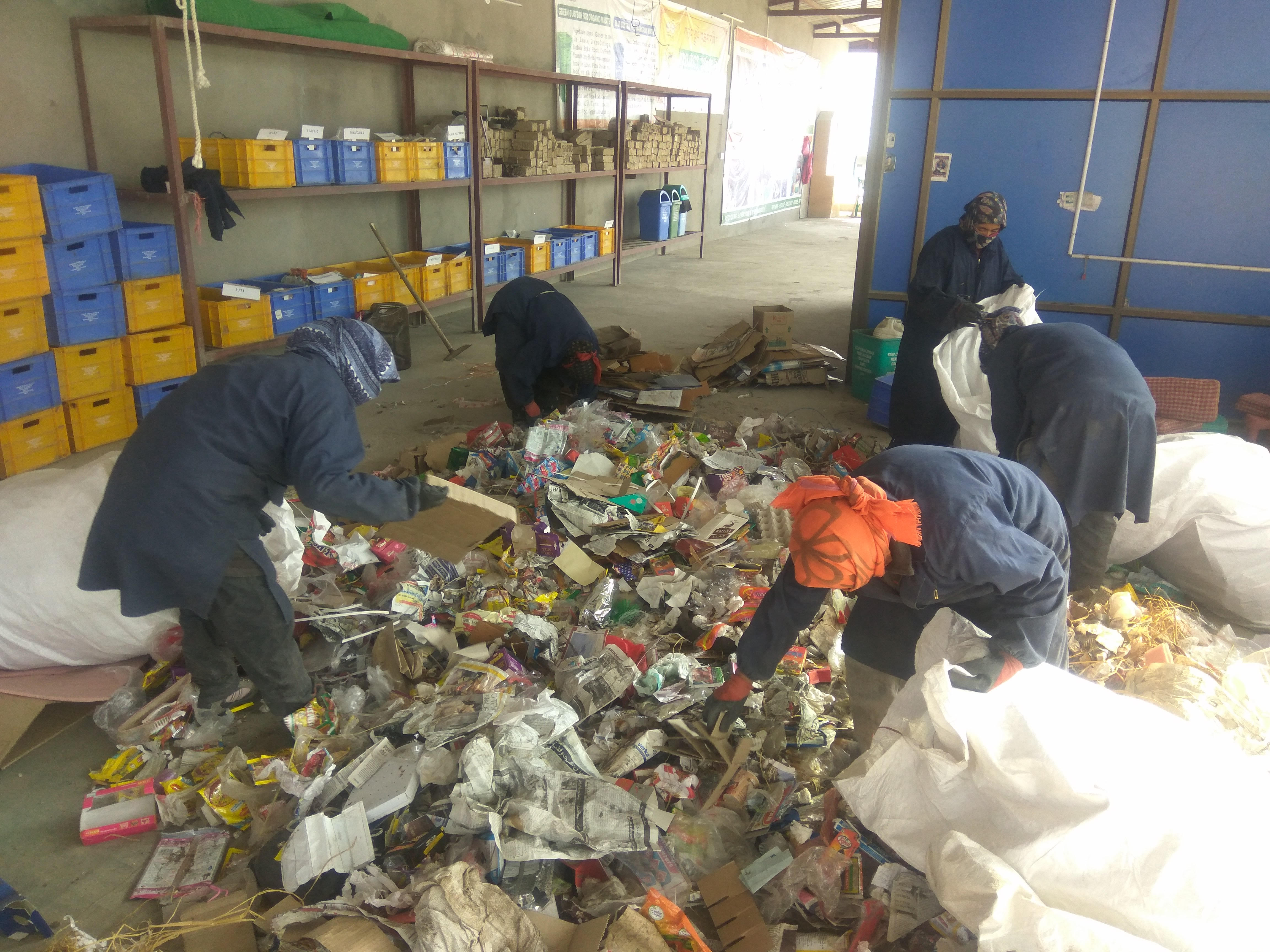 Locals working at the waste segregation centre in Choglamsar. (Source: District Administration Leh)