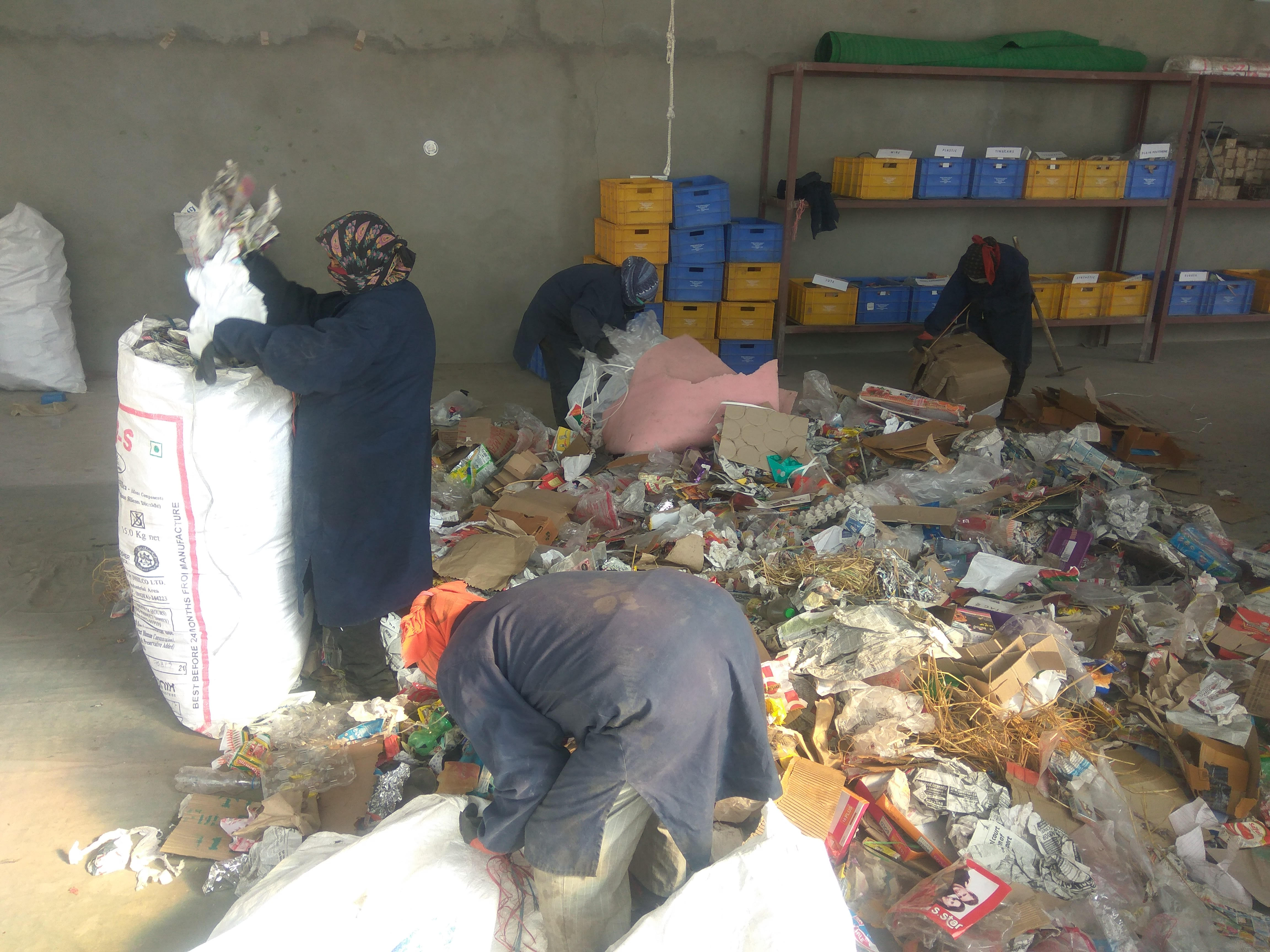 Locals working at the waste segregation centre in Choglamsar. (Source: District Administration Leh)