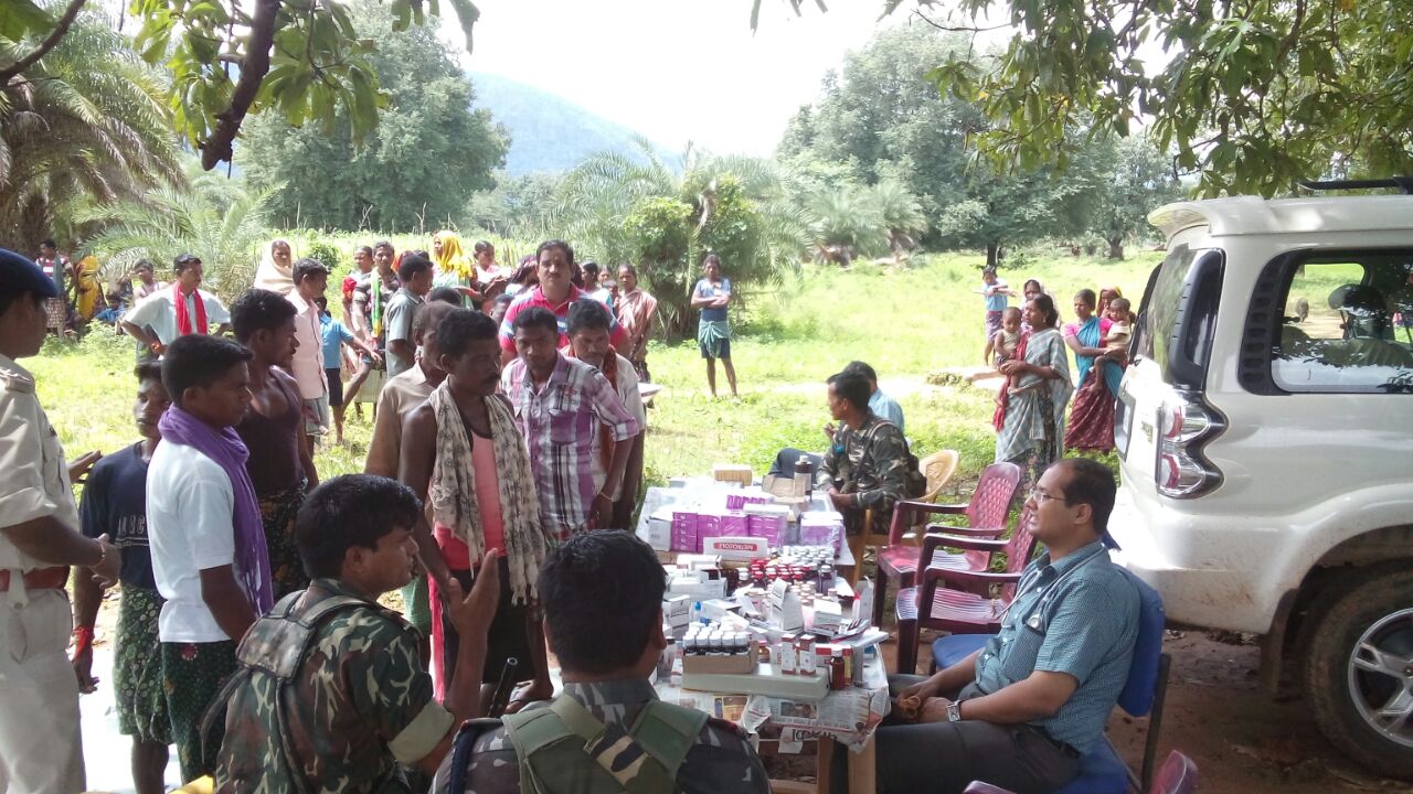 Dr Abhishek Pallava distributing medicines at a health camp. 