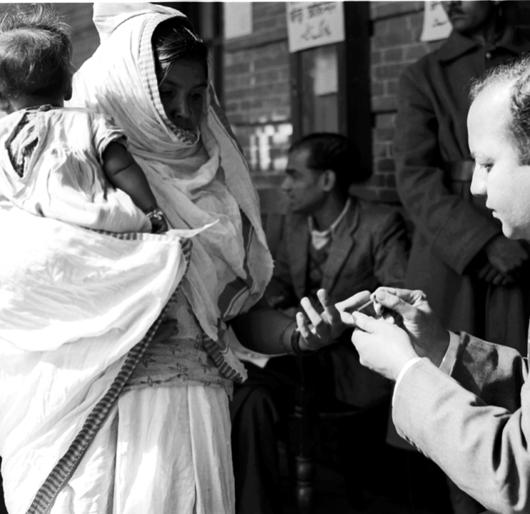 First General Elections (Polling Day in Delhi  January 14, 1952): A Polling Officers affixes indelible ink mark on the fore-finger of a voter before allowing her to cast the vote. (Source: Photodivision.gov.in)