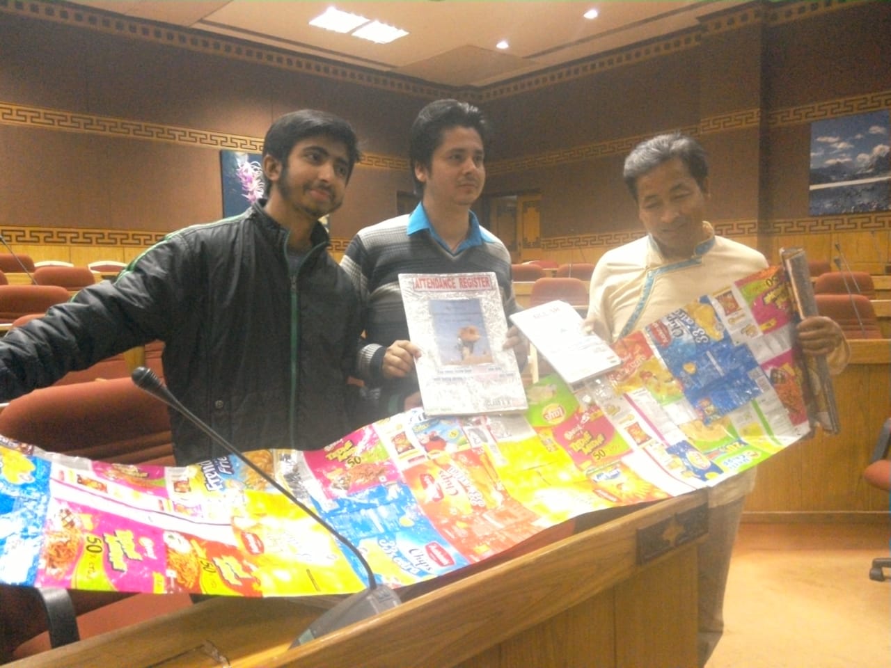 Lomas standing in the middle with the book covers made of plastic chips packets. (Source: Hariyo Makha- Sikkim Against Air Pollution)