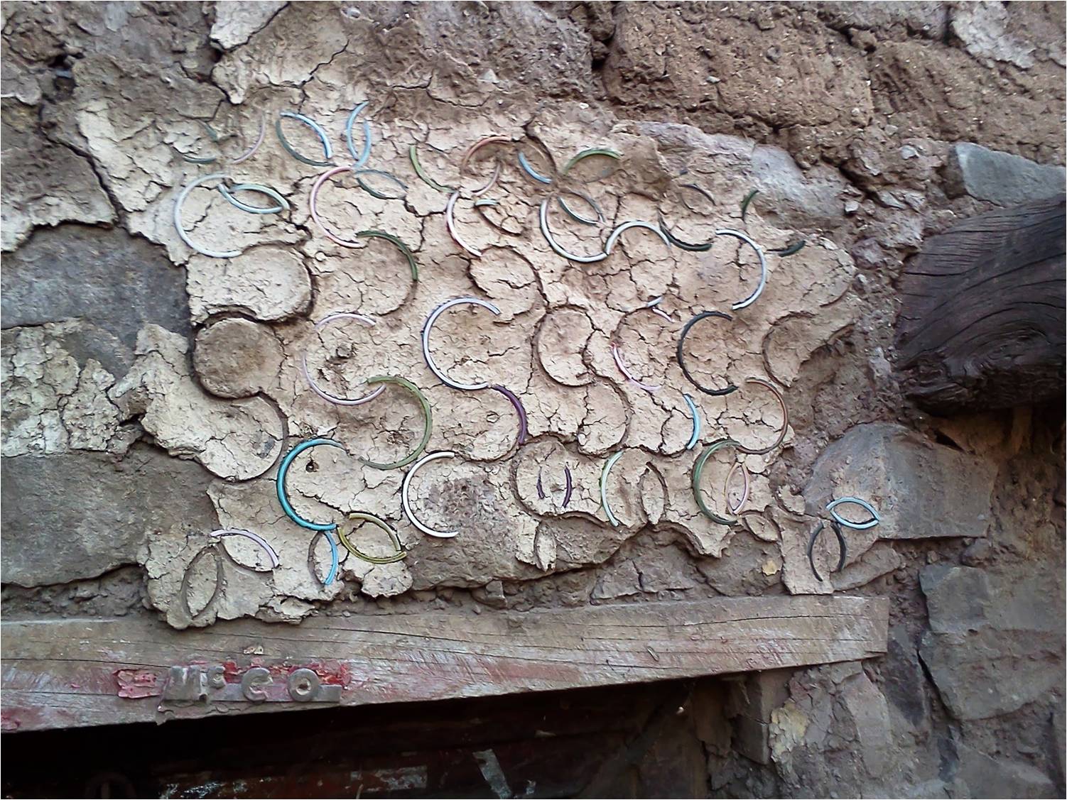 Bangles ingrained into the plaster of the lady's house in a village near Satara. (Source: Dhruvang)