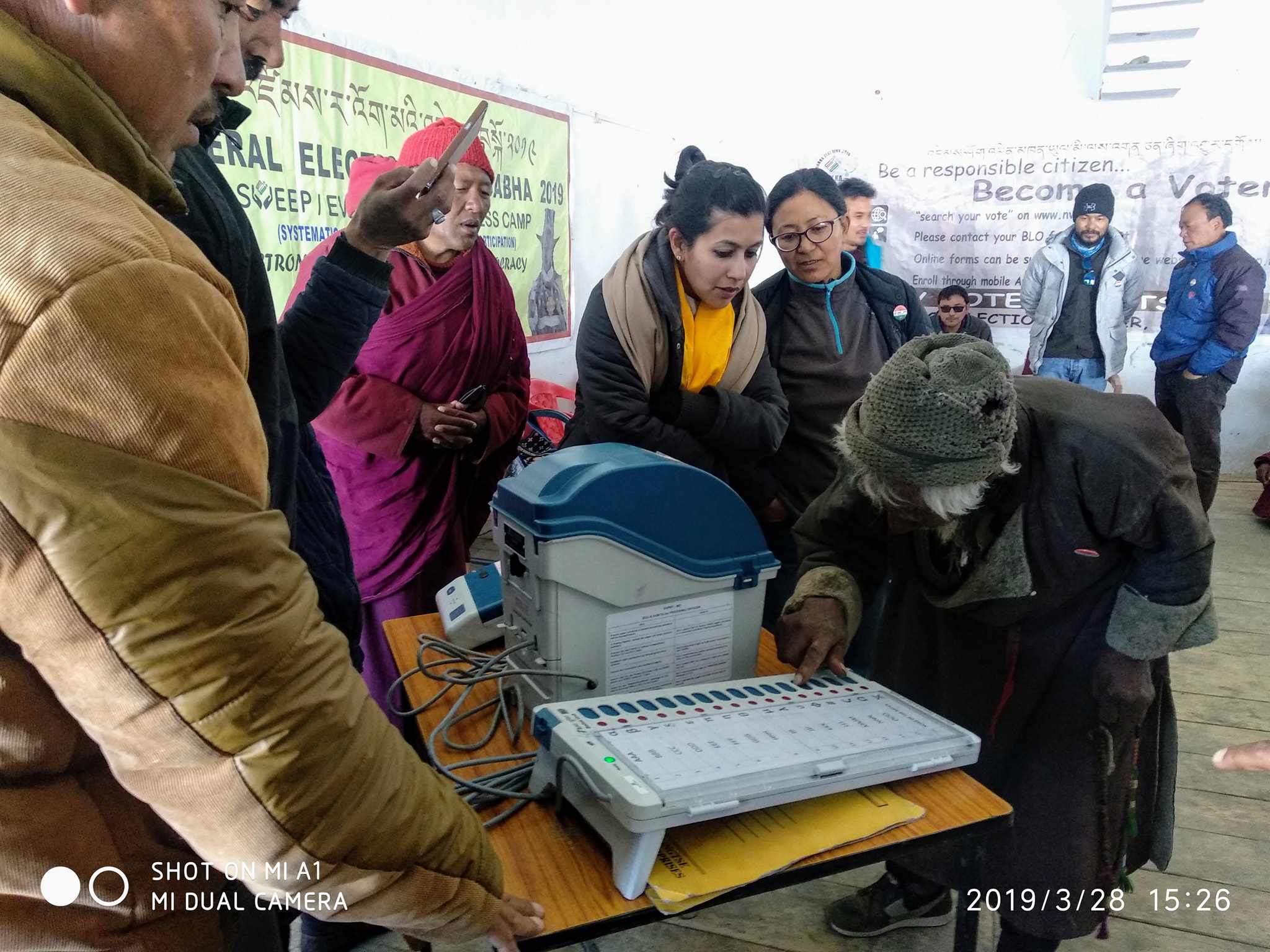 An elderly man tries his hand at an EVM machine in a remote Changthang village. (Source: Facebook)