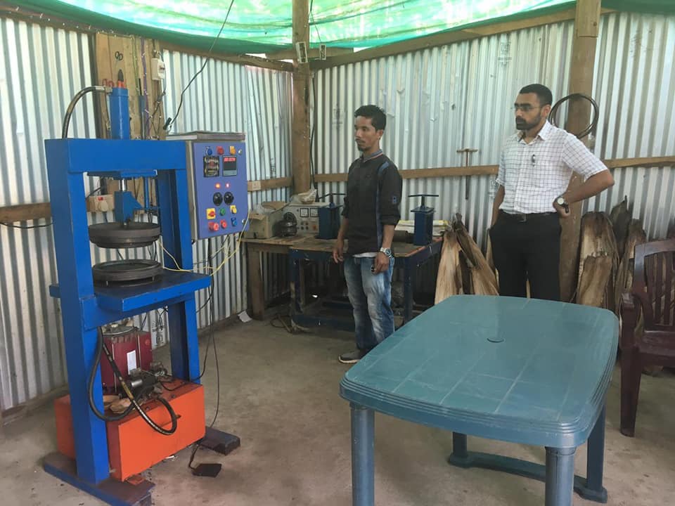 From Right to Left (Deputy Commissioner Swapnil Tembe and Dilseng Sangma observing the press machine. (Source: Facebook) 