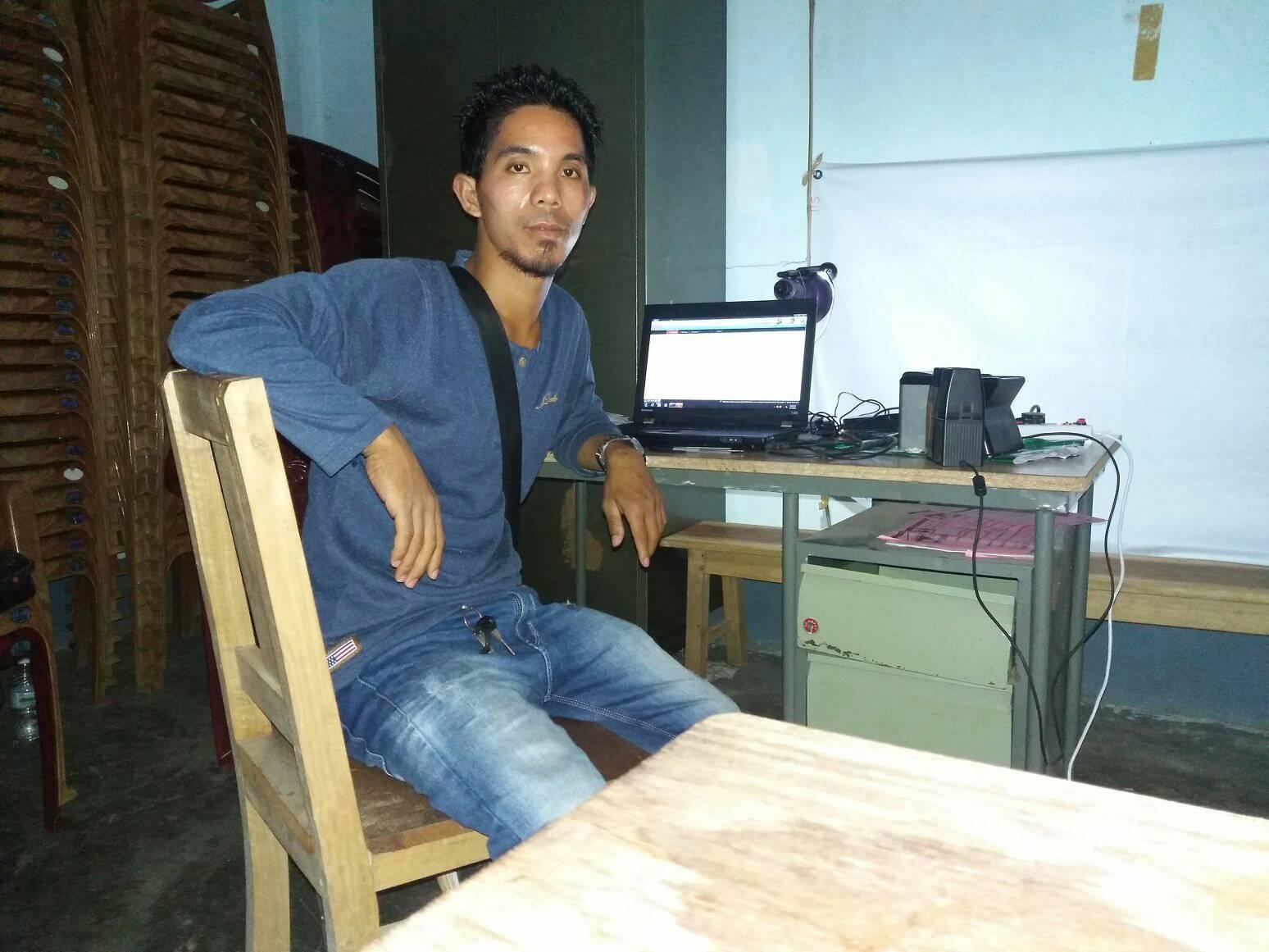 Dilseng Sangma with his laptop on which he watched YouTube videos on how to make these biodegradable plates. 
