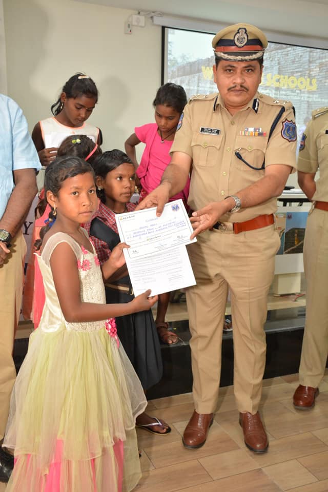 Commissioner Mahesh Bhagwat presenting certificates for students who will now re-join school in Odisha. (Source: Rachakonda PRO)