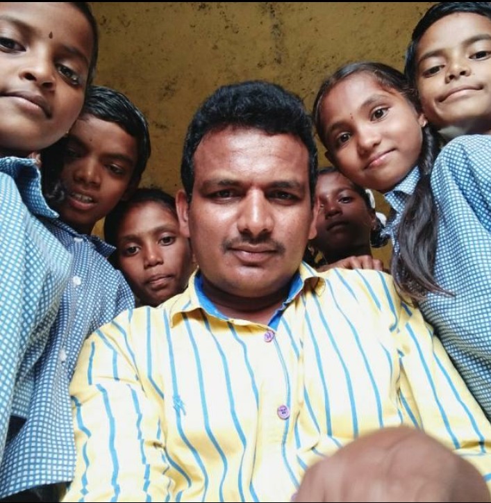 Headmaster G Satish with his students. (Source: G Satish)