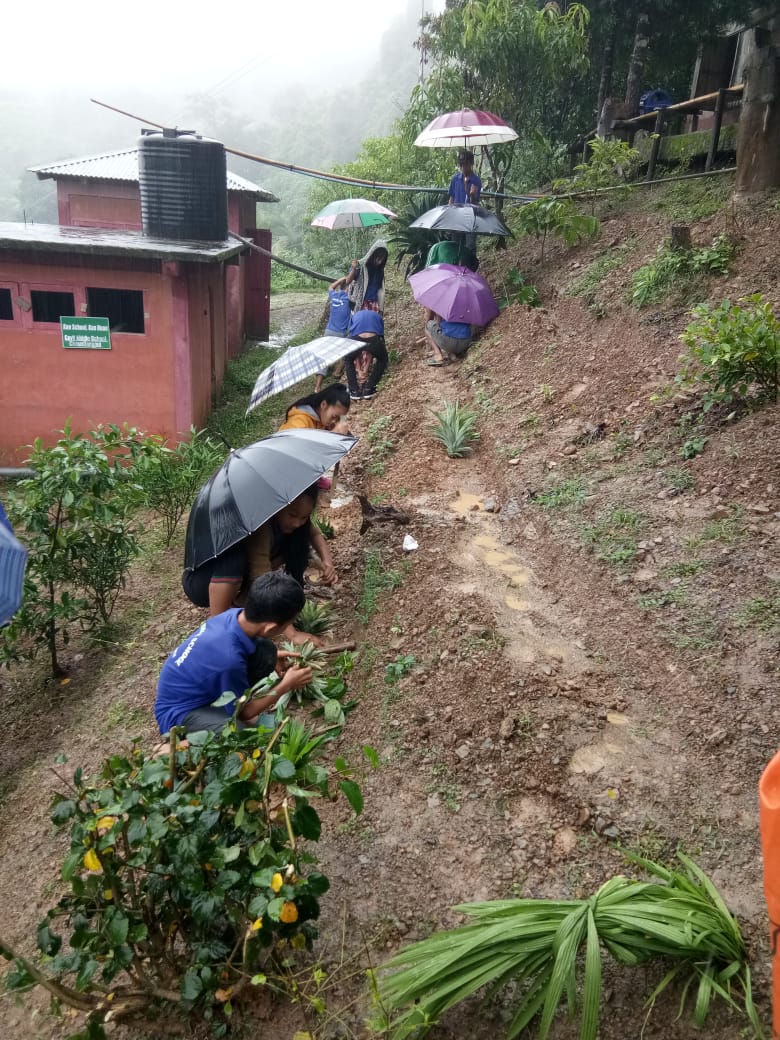 Come rain, come shine, these students are preparing for a healthy future. (Source: Students preparing the ground for nutrition garden. (Source: DC Lawngtlai)