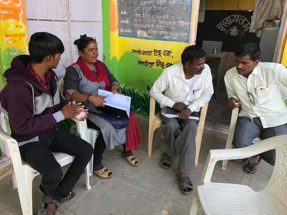 Sunita discussing matters with some of her volunteers. 