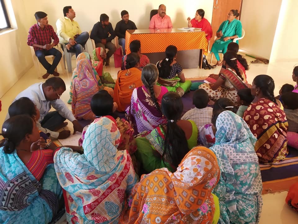 Sunita addressing local government officials alongside other women from the Pardhi community. 