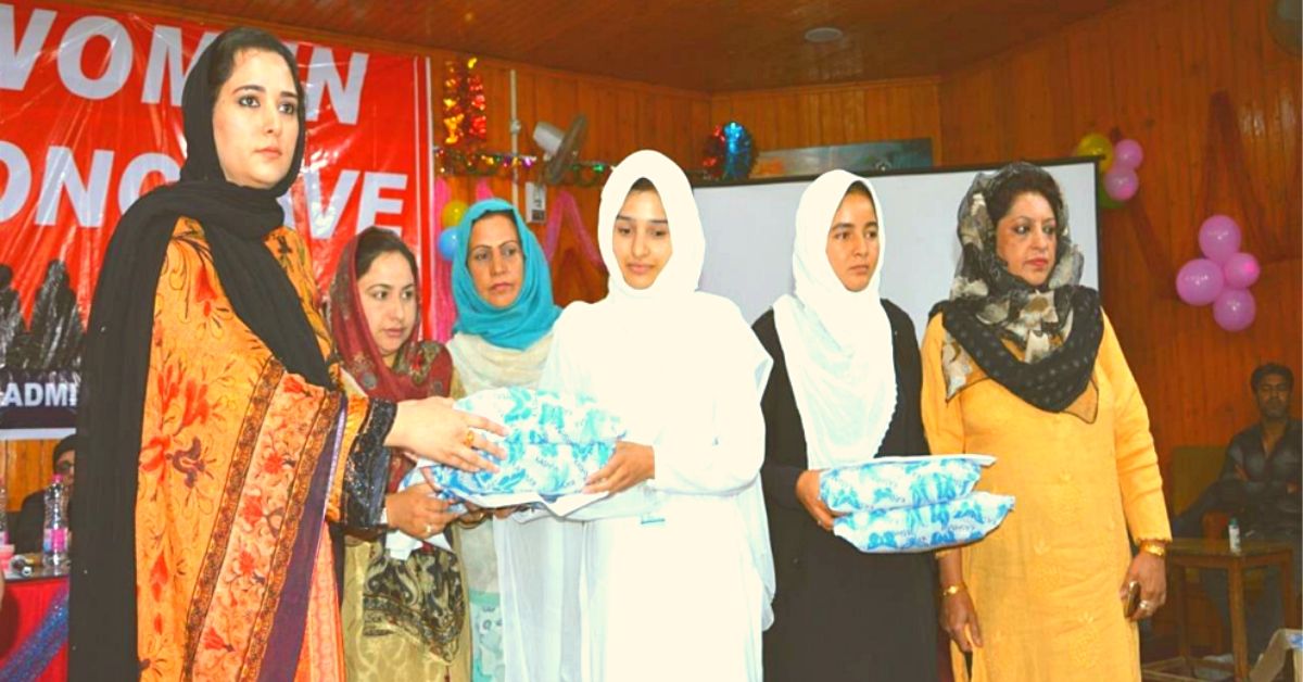 DC Syed Sehrish Asgar giving away sanitary pads to young school girls during an awareness drive.. 