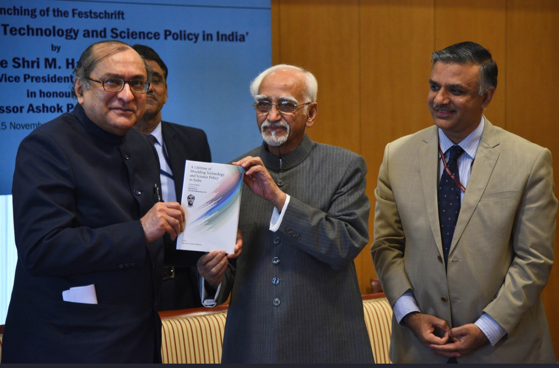 Ashok Parthasarathi standing alongside former Vice President Hamid Ansari. (Source: Twitter/RIS)