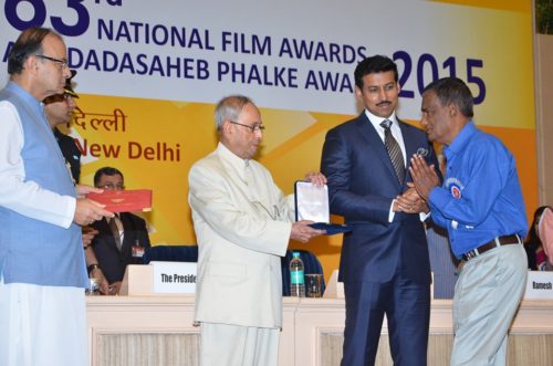 Mr Pomu Das (father of Pradip Kurbah) and producer of the National Award winning film 'Onaatah' receiving the Award from former President Pranab Mukherjee. (Source: Patricia Mukhim) 
