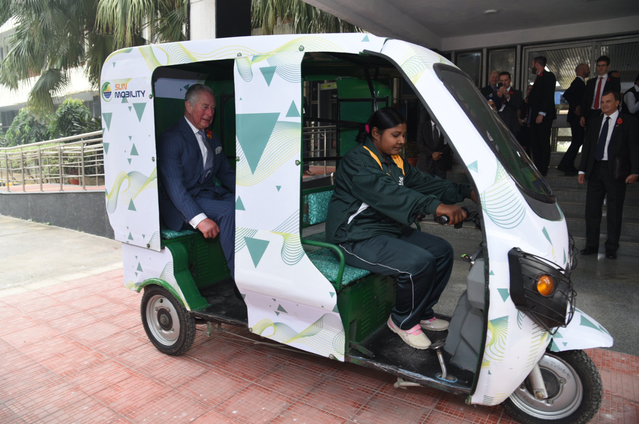 The Prince of Wales takes a ride on an e-rickshaw powered by SUN Mobility's smart batteries. (Source: Twitter/SUN Mobility)
