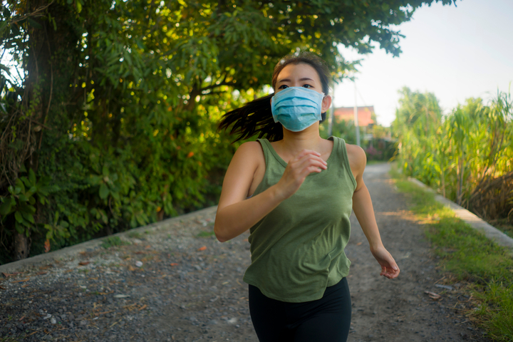 girl exercising wearing mask