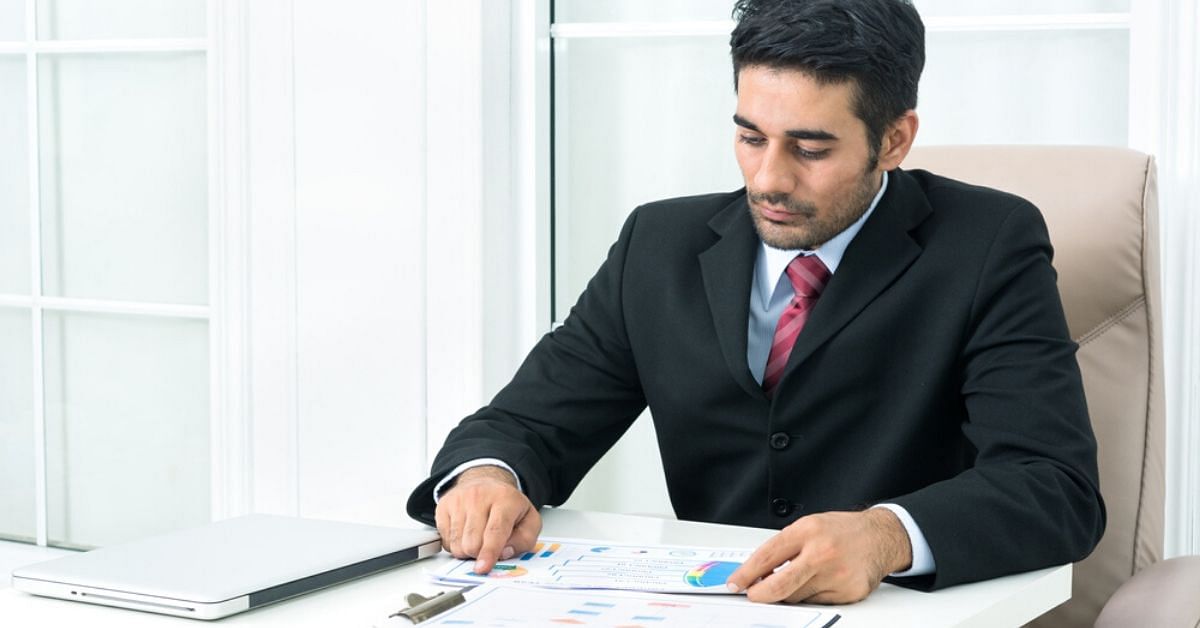 DRDO man sitting and looking at job openings.