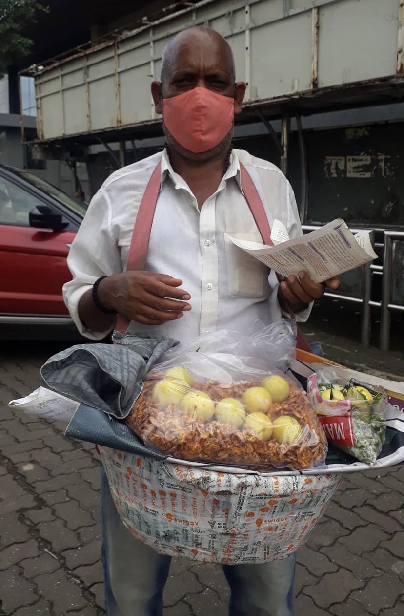 A Man selling Chana jor Garam in Mumbai near Mithibai College 