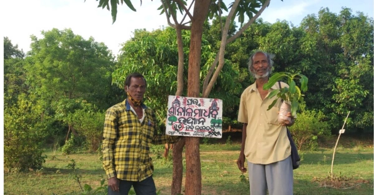 Antaryami Sahoo with a villager for tree plantation