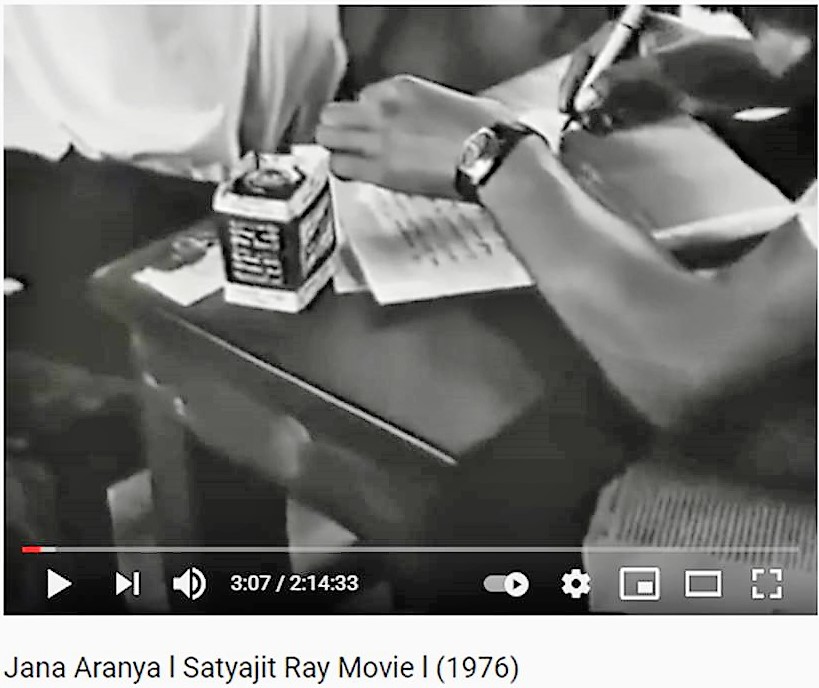 A screenshot of the first scene of Jana Aranya, Satyajit Ray's movie with Sulekha ink bottle