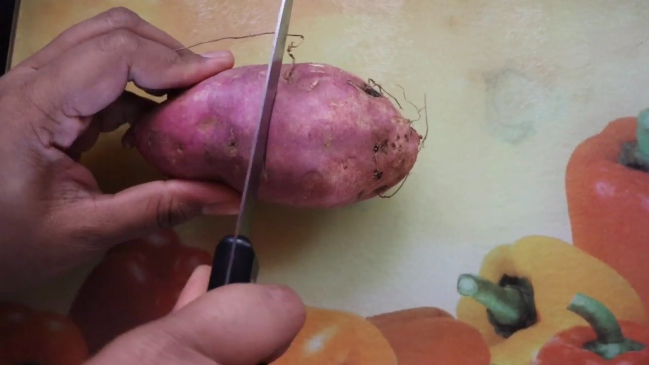 first step to grow sweet potato without seeds is Cut it into two halves.