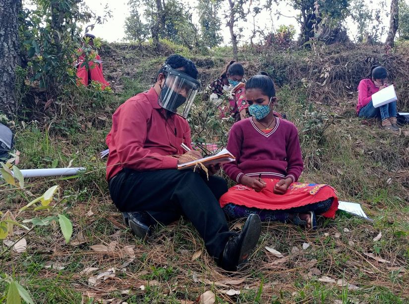 Kalyan Mankoti while holding classes in the field.