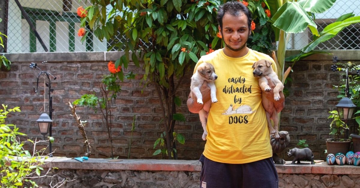 Animal Adoption: Kapil with rescued puppies and wearing merchandise