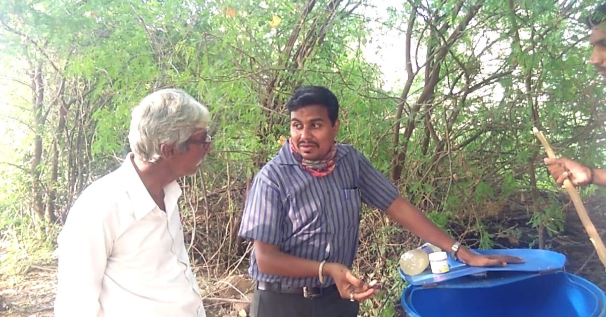 organic farming: Yuvraj demonstrating preparation of organic fertiliser.