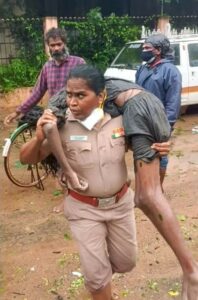 Inspector Rajeshwari carrying the fainted man on her shoulders during Chennai floods.