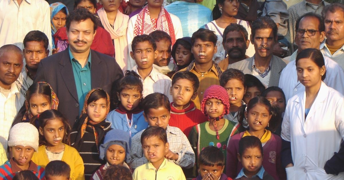 Dr Subodh Kumar Singh with kids at camp undergoing free cleft lip surgery.
