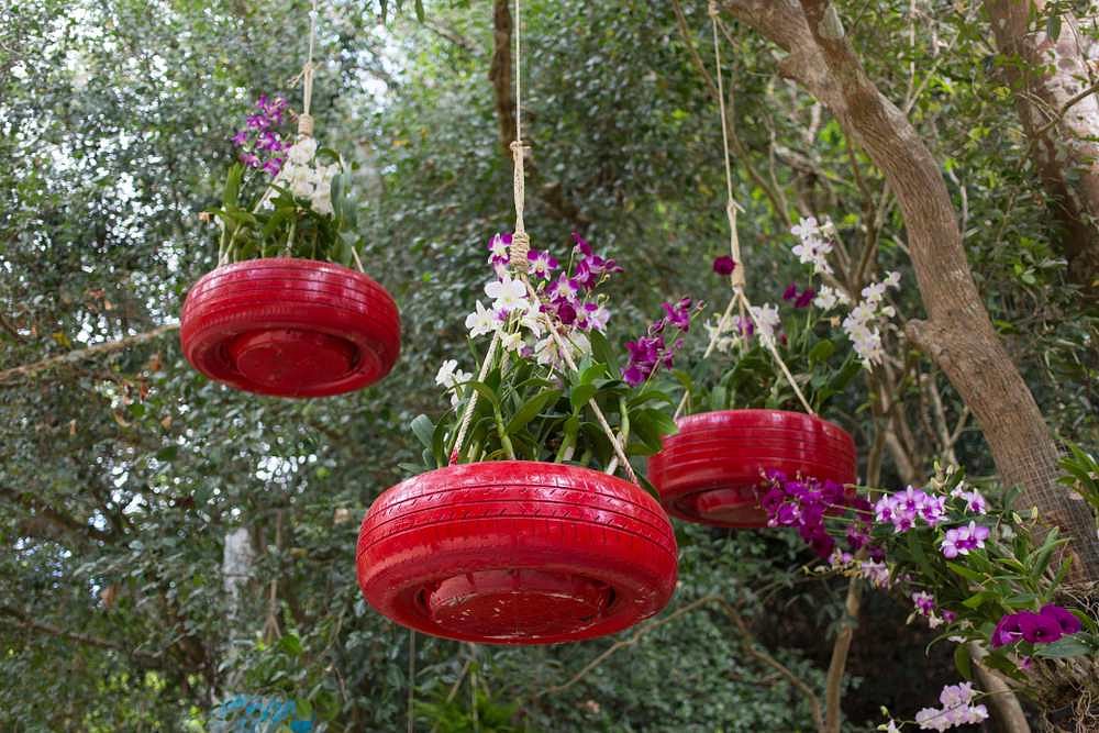 Hanging planters out of worn-out tyres