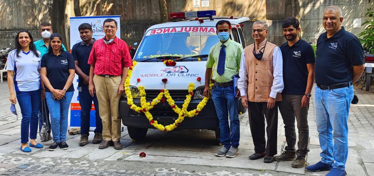 An ambulance being donated for the work done by the doctor. 