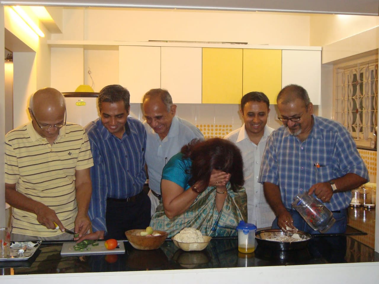 Group of men learning to cook