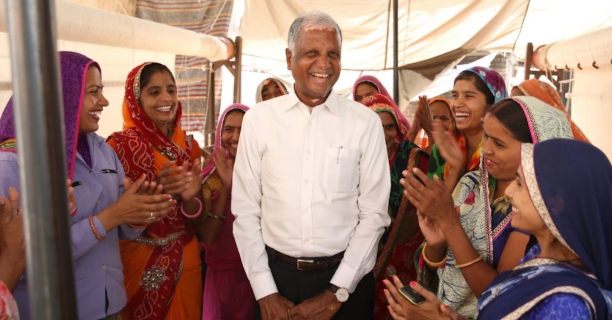 jaipur rugs founder nand kishore chaudhary with women artisans