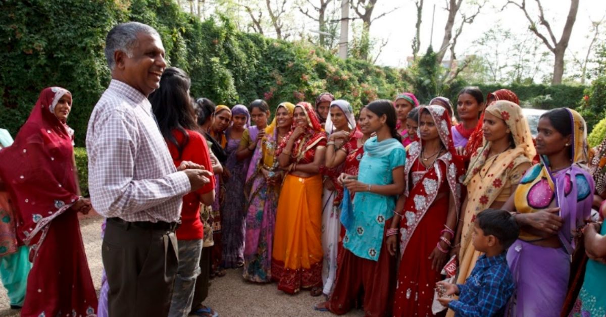 jaipur rugs founder nand kishore chaudhary with women artisans