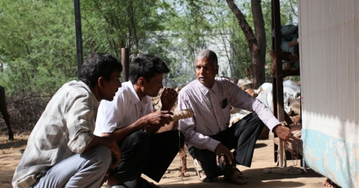 jaipur rugs founder nand kishore chaudhary with women artisans