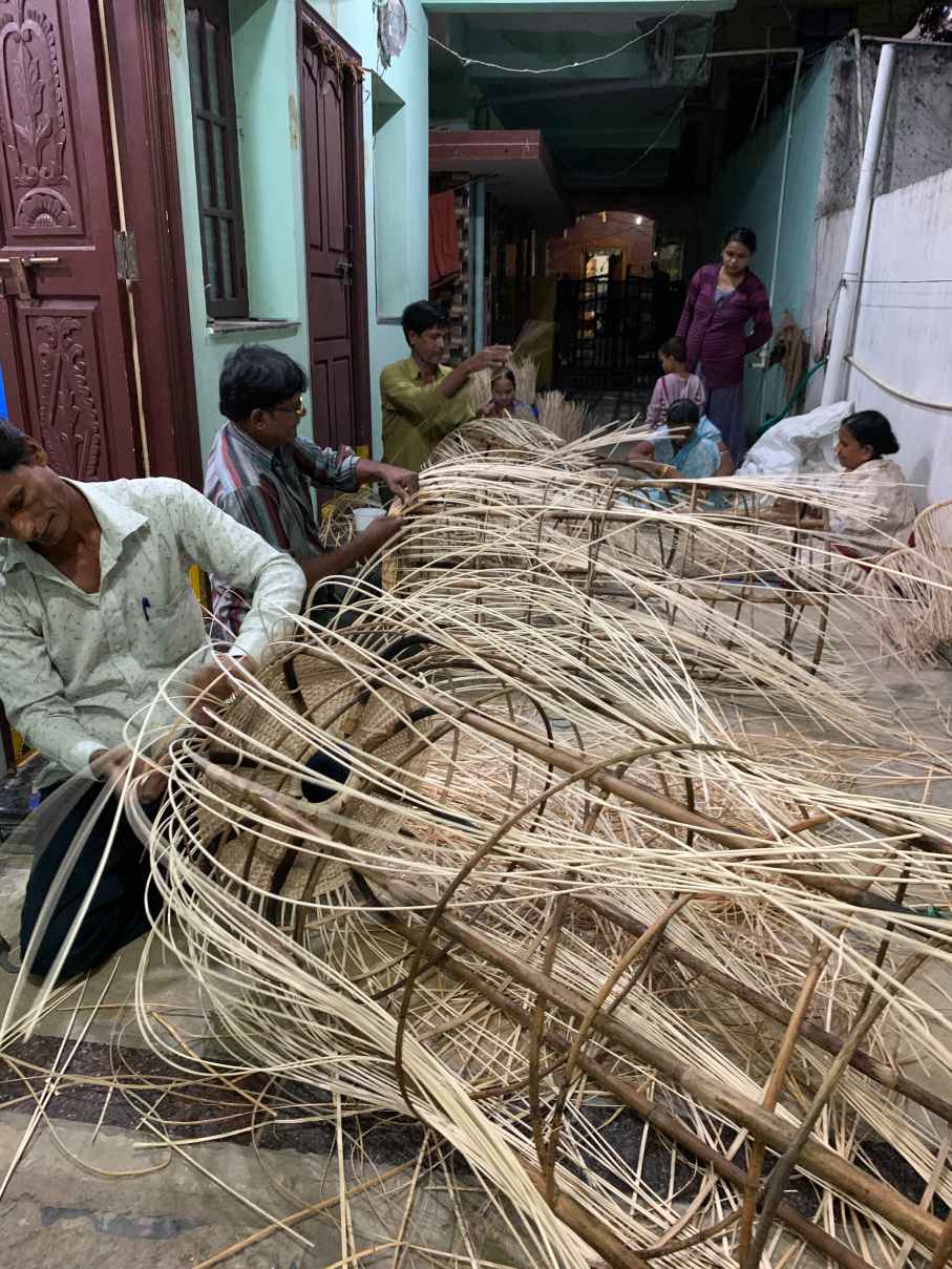 Wicker weavers weaving Rattan furniture
