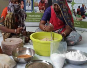 Women helping in the making of dried oyster mushroom seasonings