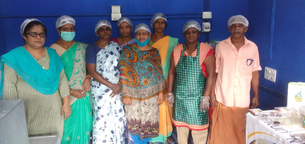 Rajasree (left) with the workers at her unit