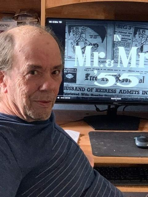thomas daniel, an american youtuber who restores classic indian movies, sits in front of a computer while editing mr and mrs 55