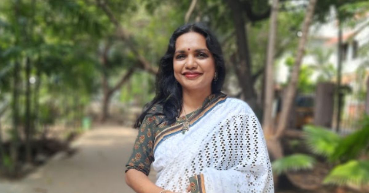 chennai resident sumithra sriram, a mother of two children, stands in a white saree and brown blouse