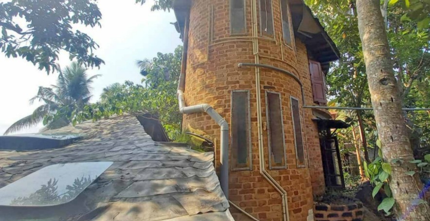 the side view of an eco friendly house in kerala