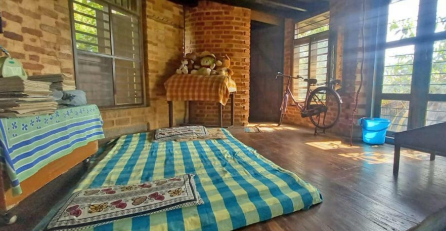 a bedroom in an eco friendly house in keral 