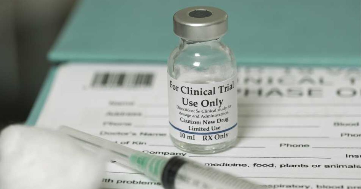 a vial of drug to be administered for a clinical trial, and syringes and a form 