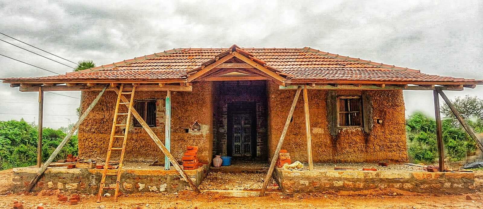 An eco-home under construction with steep slopes.