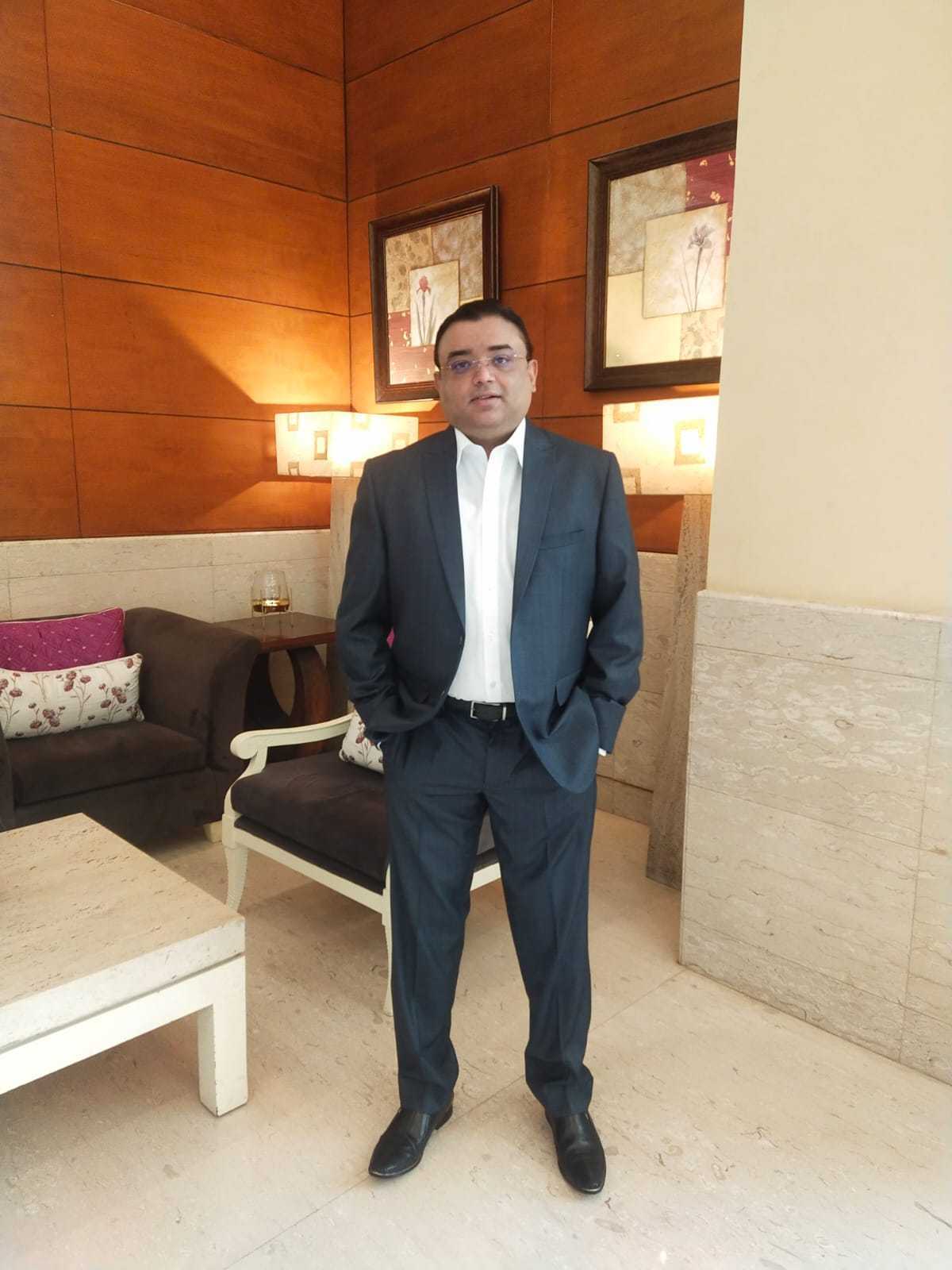 green trek founder sandeep gupta in a black suit