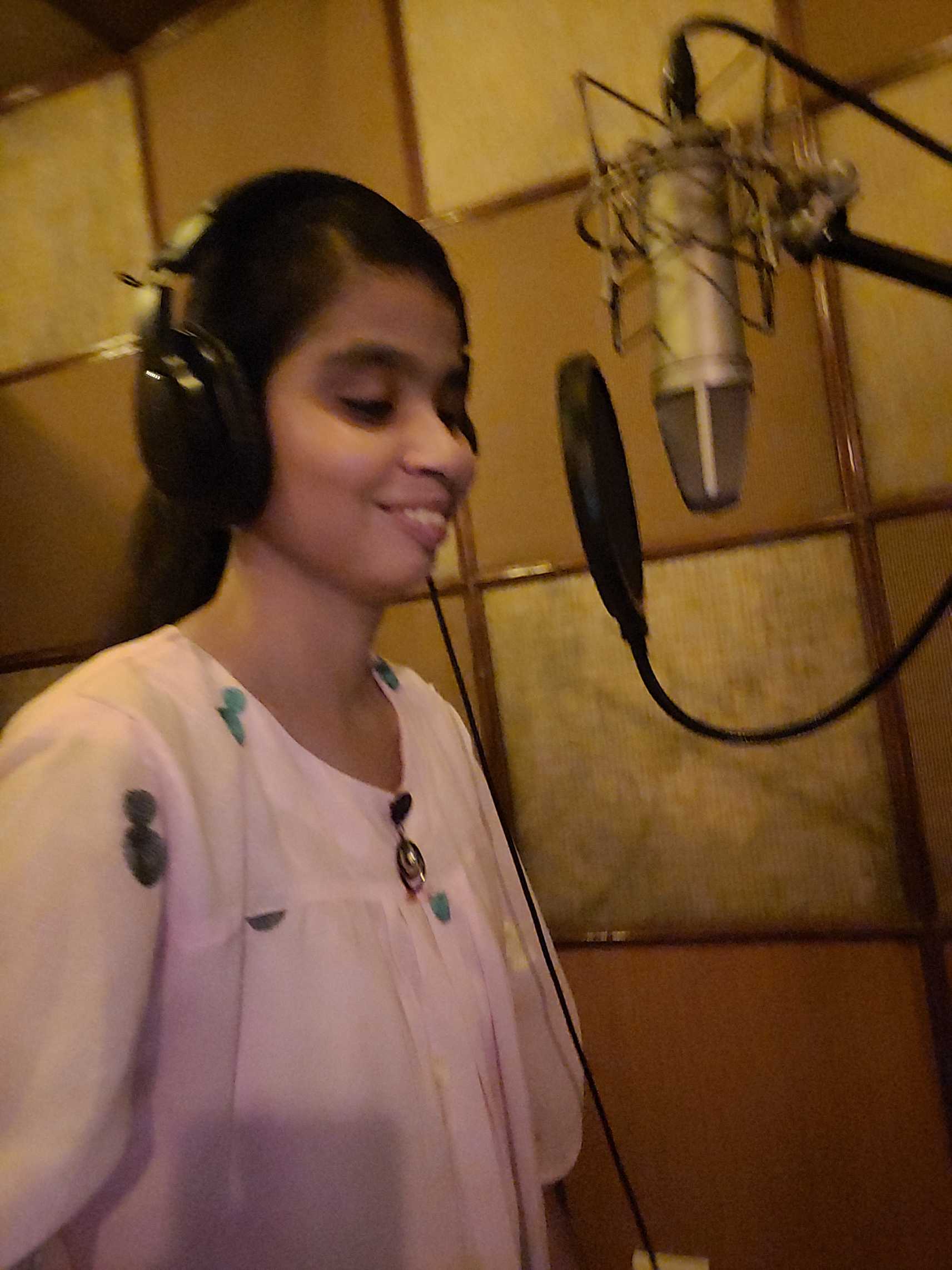 blind voiceover artist resham talwar at a recording studio