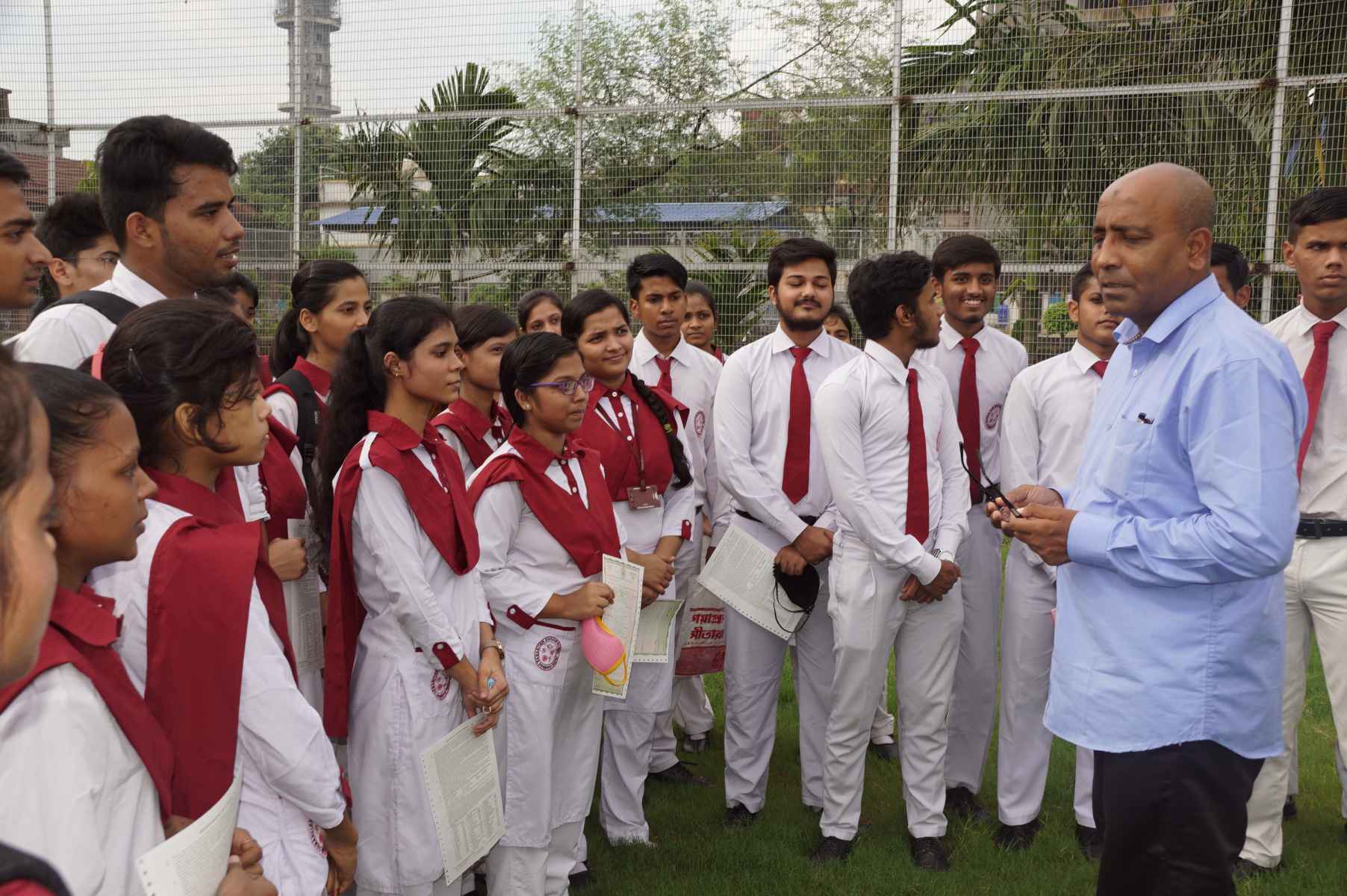 At the Samaritan Mission School, graphics teacher Mamoon Akhtar addresses young students