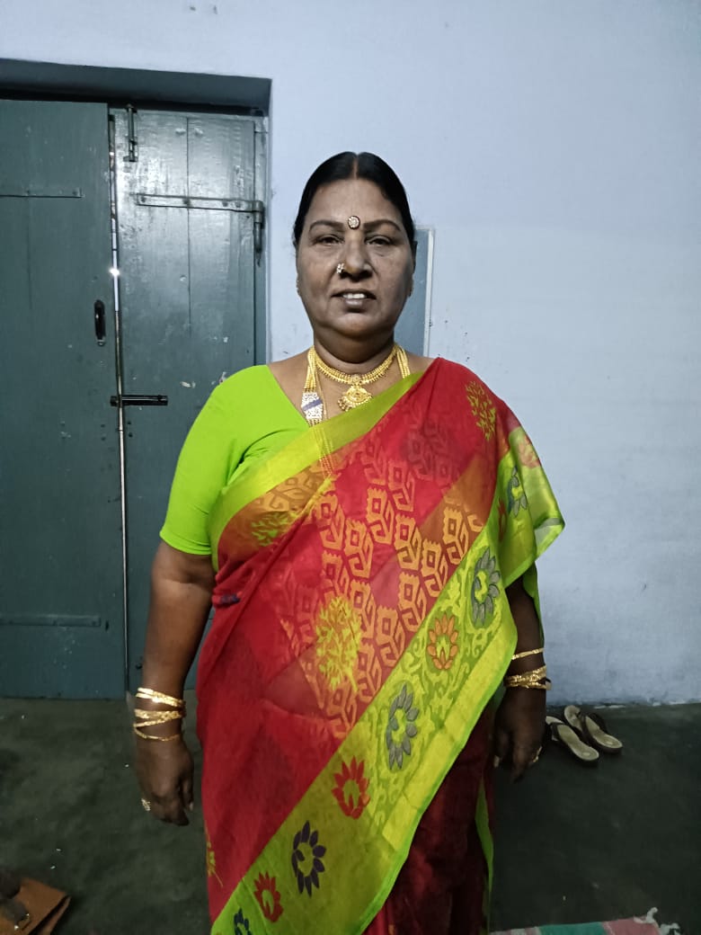 coimbatore based trans woman and caterer madhana amma dresses up in a green and red saari for an event