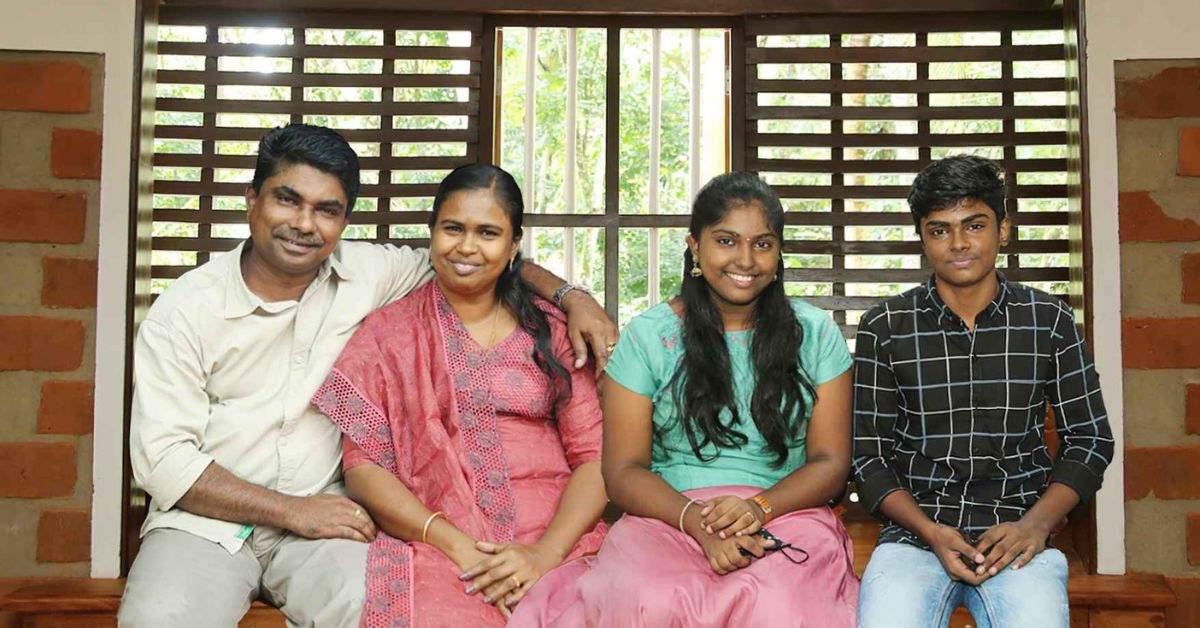kottayam resident Manoj Mathew and his family in their eco friendly home made from 100 year old recycled wood
