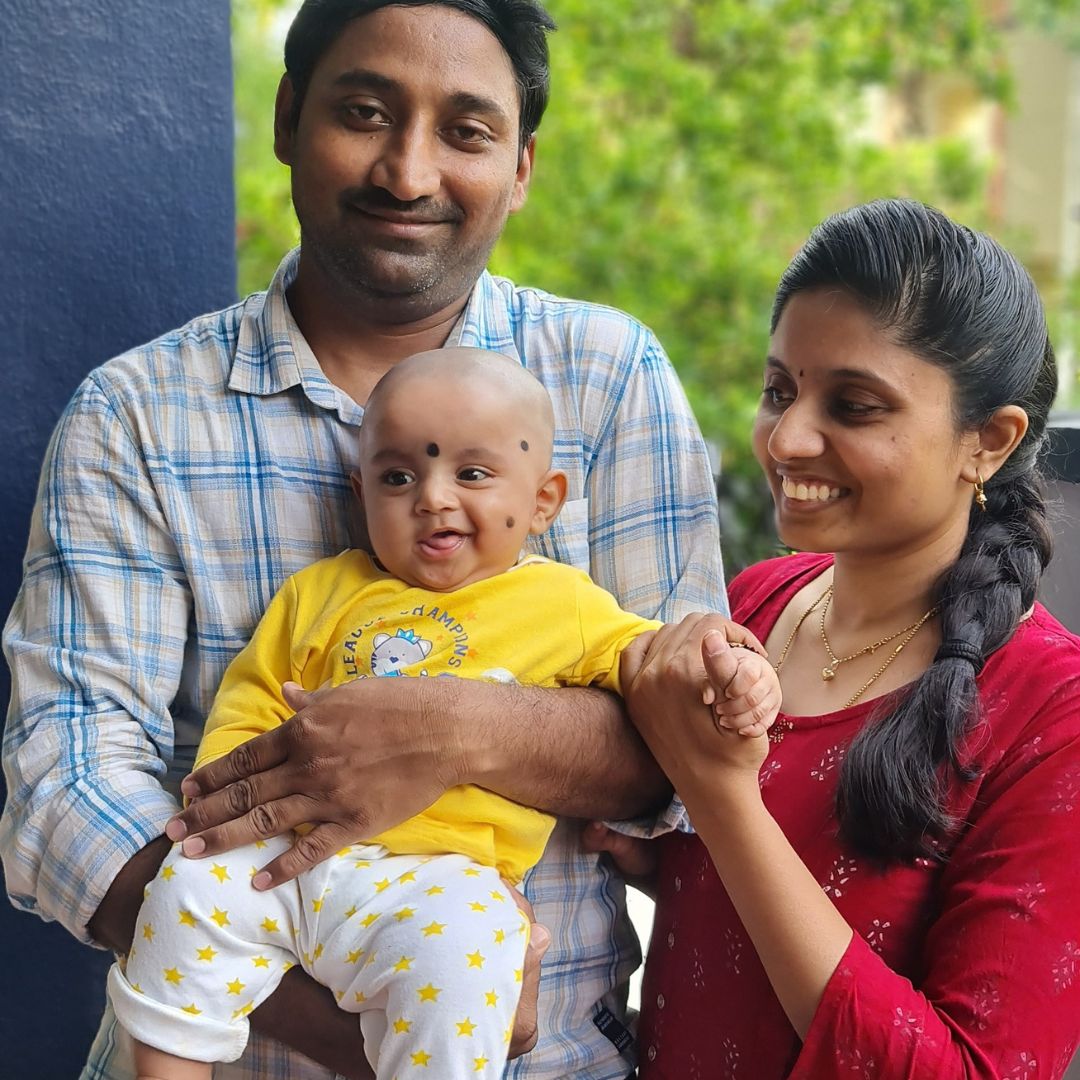 Poojitha with her husband and baby